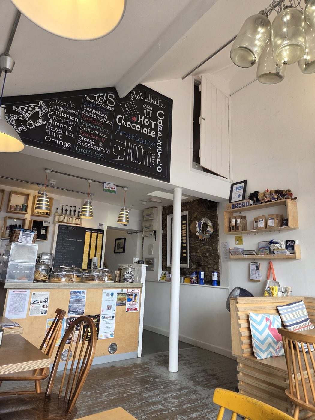 The counter and tables under chalkboard menus